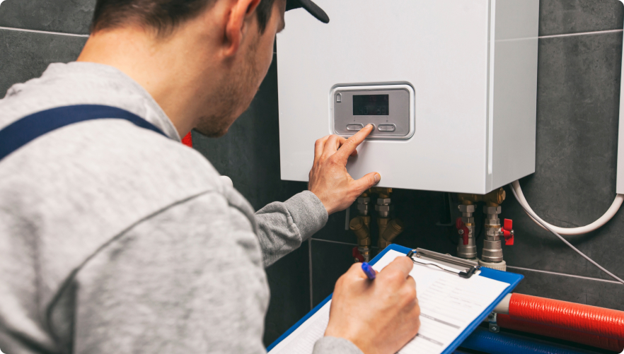 tech installing a water heater